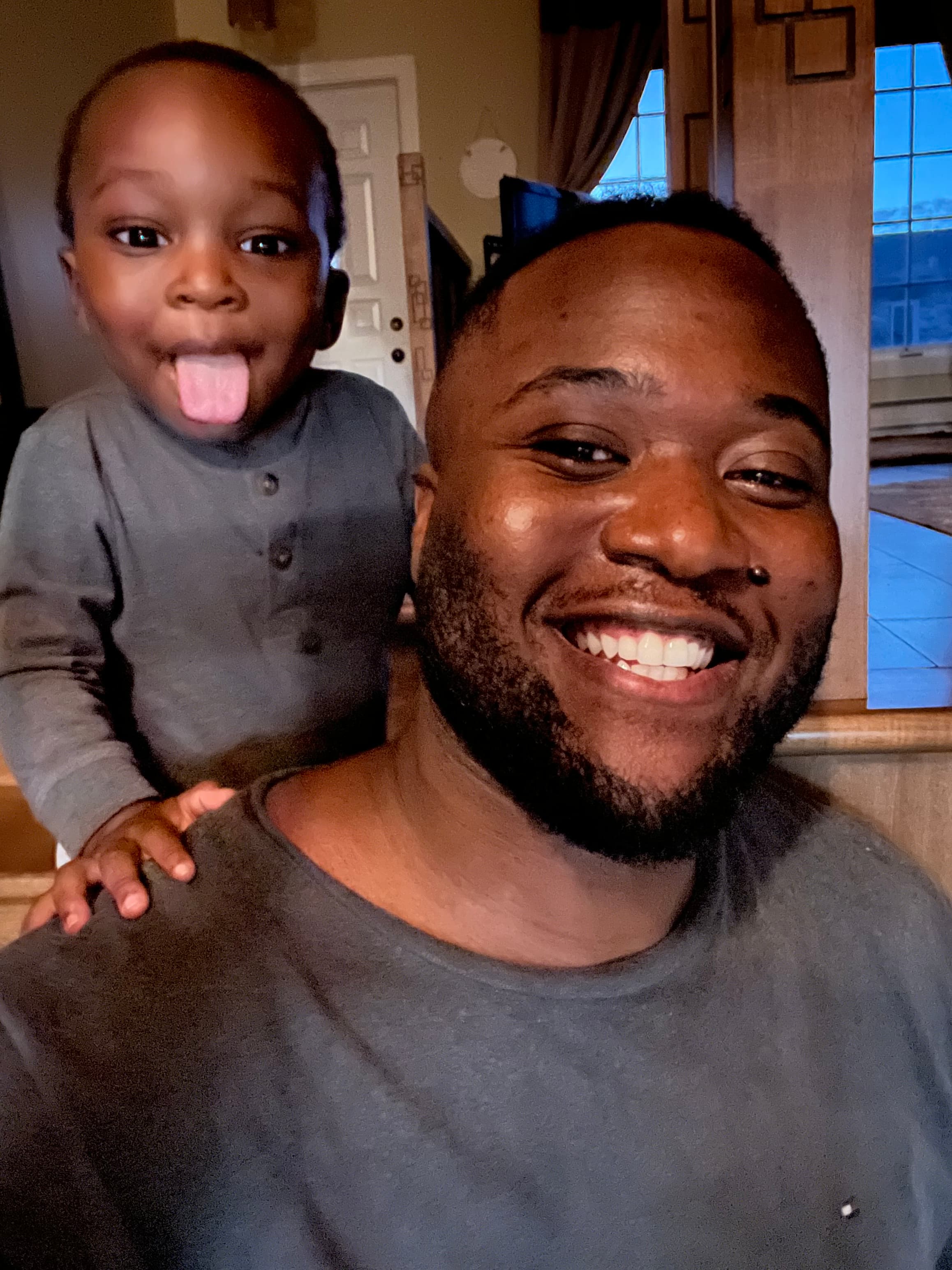 Yann smiling at nephew being silly